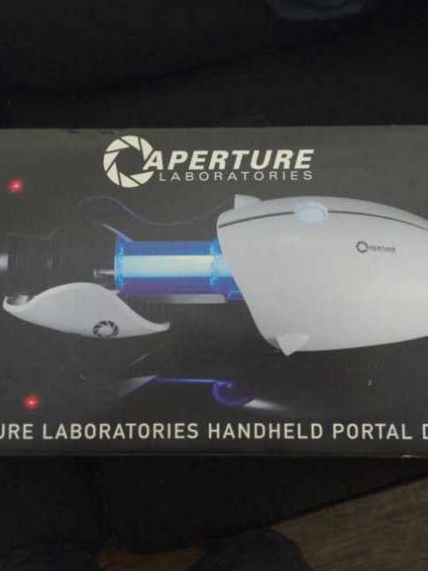 Aperture Laboratories Handheld Portal Device - Neca (Portal) action figure collectible [Barcode 634482450659] - Main Image 1