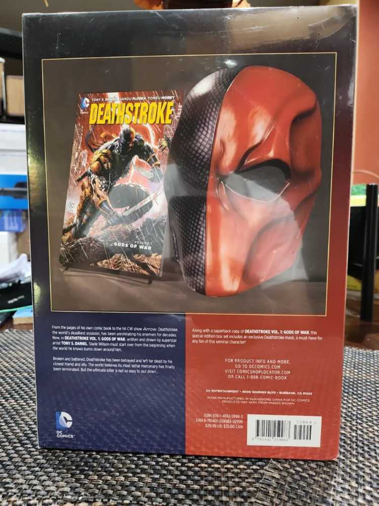 DC Comics Deathstroke (2014) Vol. 1: Gods of War with Deathstroke Mask  (DC Comics) action figure collectible [Barcode 9781401259983] - Main Image 2