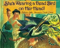 She’s Wearing A Dead Bird On Her Head!!