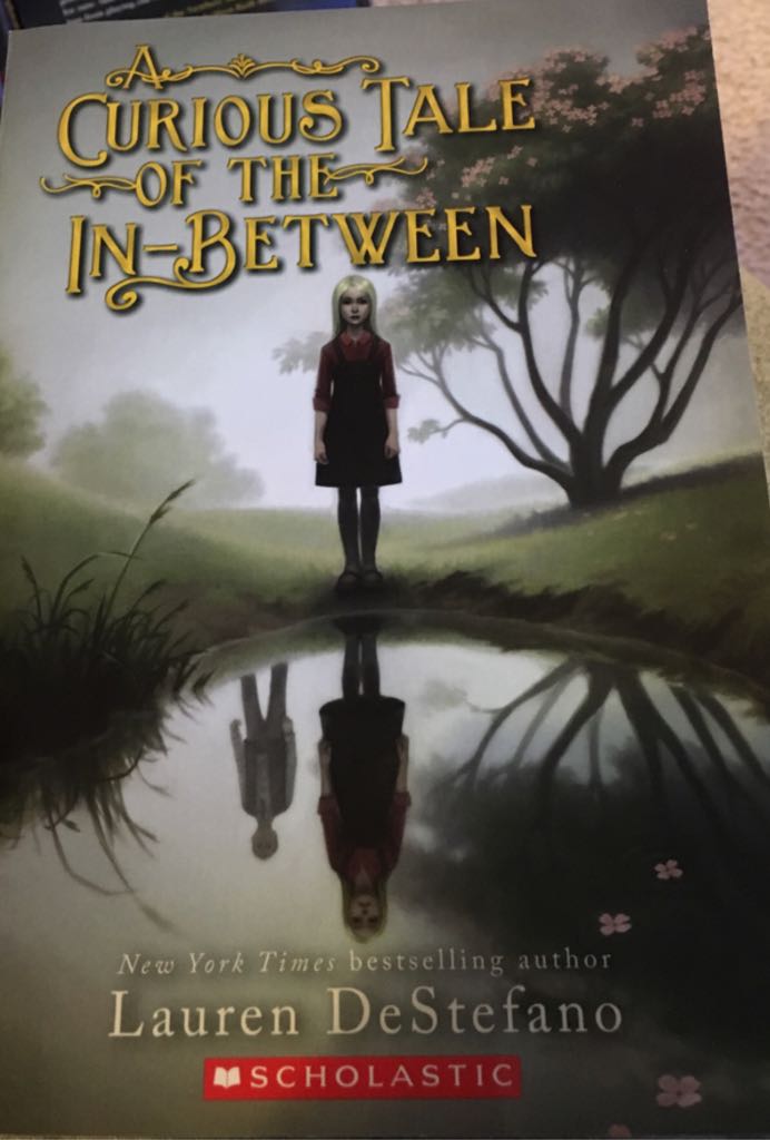 A Curious Tale Of The In-Between - Lauren Destefano (- Paperback) book collectible [Barcode 9780545908542] - Main Image 1