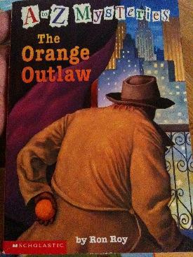 A-Z Mysteries O: The Orange Outlaw - Ron Roy (Scholastic Inc - Paperback) book collectible [Barcode 9780439516839] - Main Image 1
