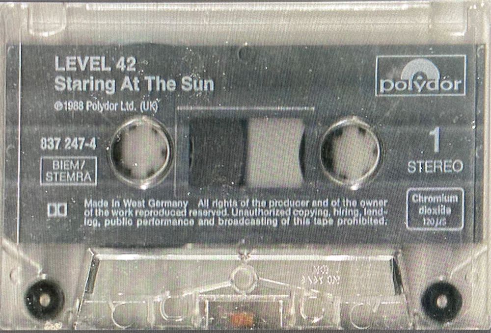 Staring At The Sun - Level 42 (Cassette - 43.42) music collectible [Barcode 042283724747] - Main Image 2