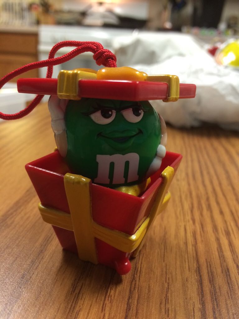 M & Ms - Green Popping Out Of A Present  ornament collectible - Main Image 1