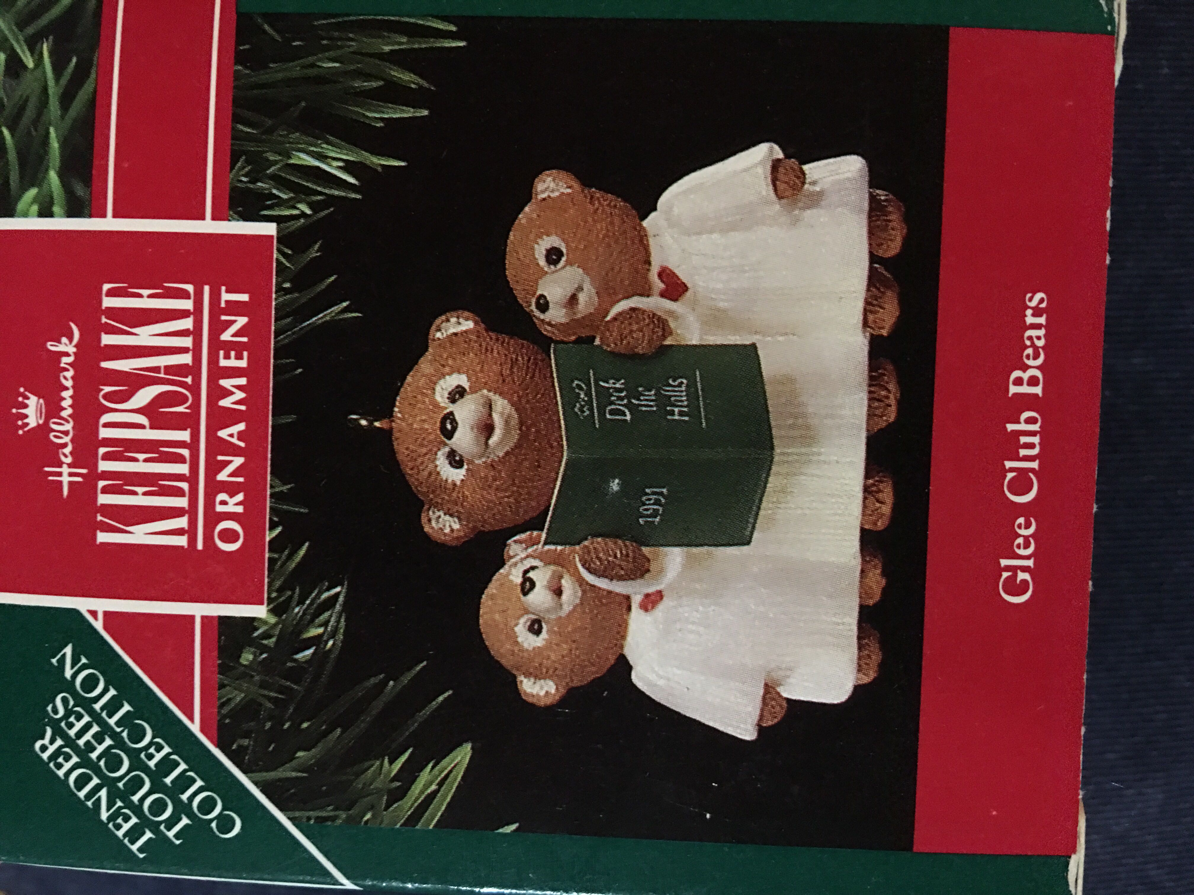 Burgundy ball with white swirls and flowers and gold glitter