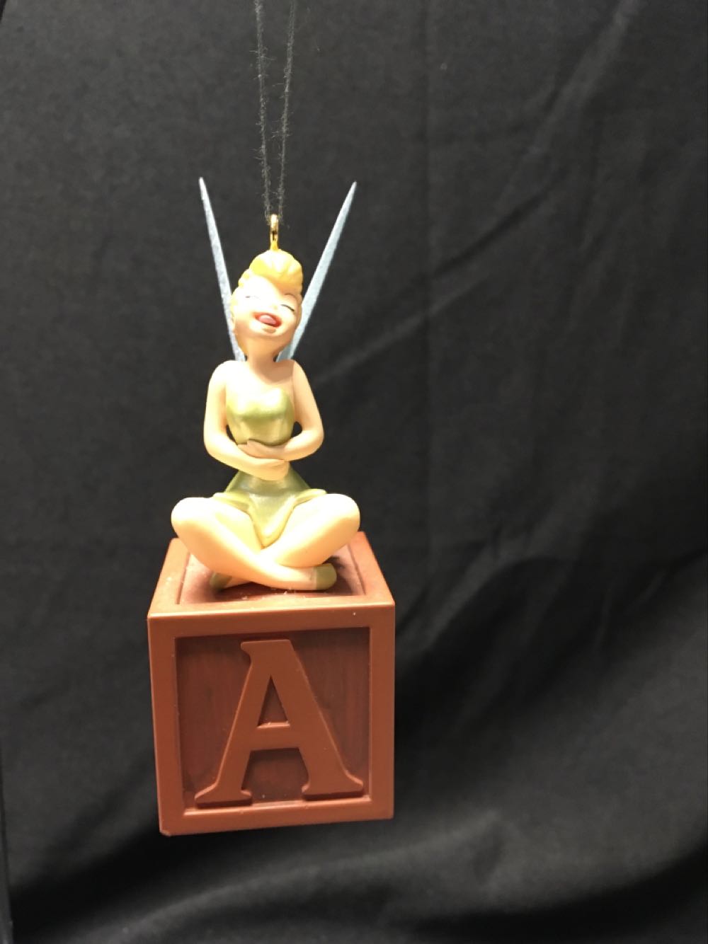 Clear Cylinder With Tinsel Inside And Red Top And Bottom