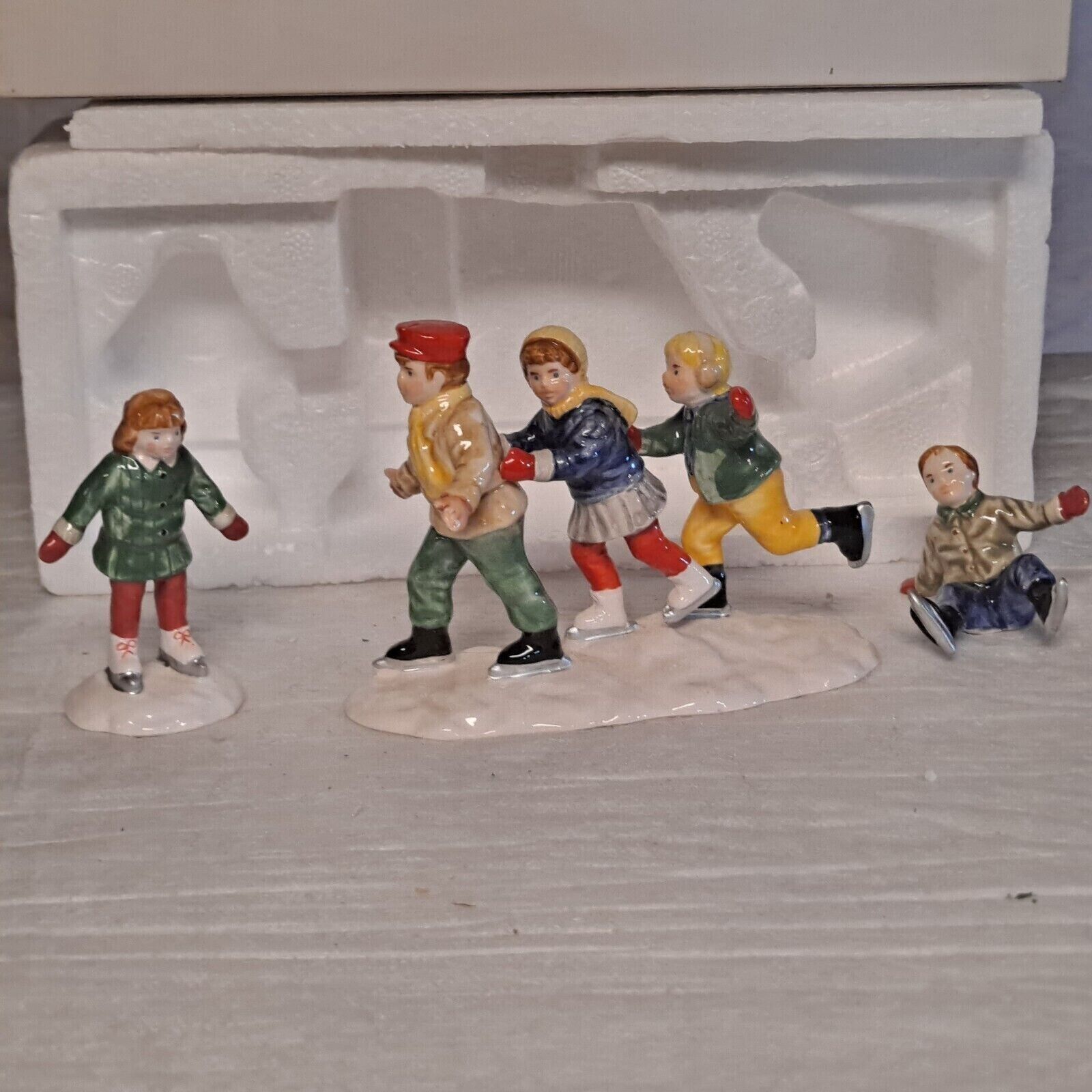 Crack The Whip Skaters - The Original Snow Village (Department 56) ornament collectible - Main Image 1