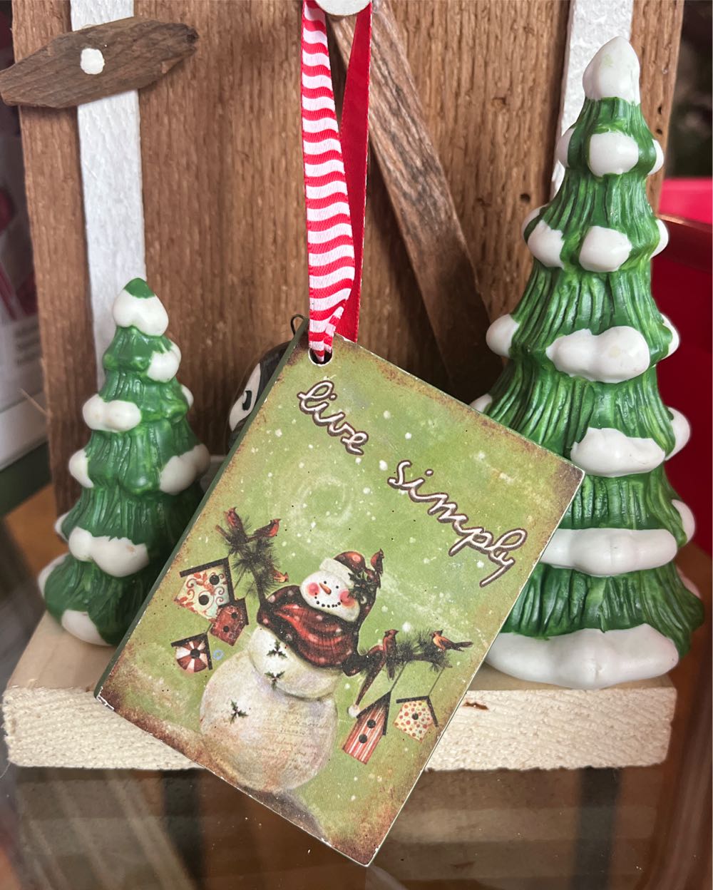 Handmade Snowman Ornament On Tree Slice