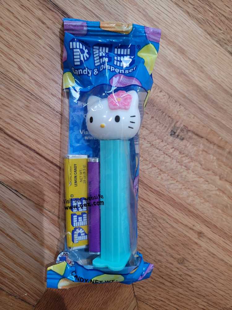 Hello Kitty - Kitty, head w/pink flower, teal stem - Hello Kitty - Sanrio pez collectible [Barcode 073621091504] - Main Image 2