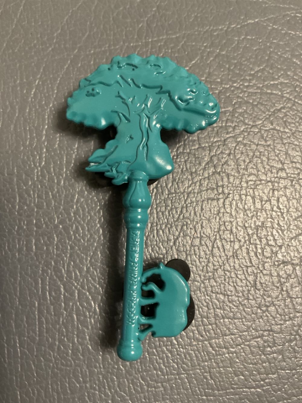 Cheshire Cat Sitting On Blue Flower