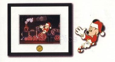 Ariel sitting, holding something?