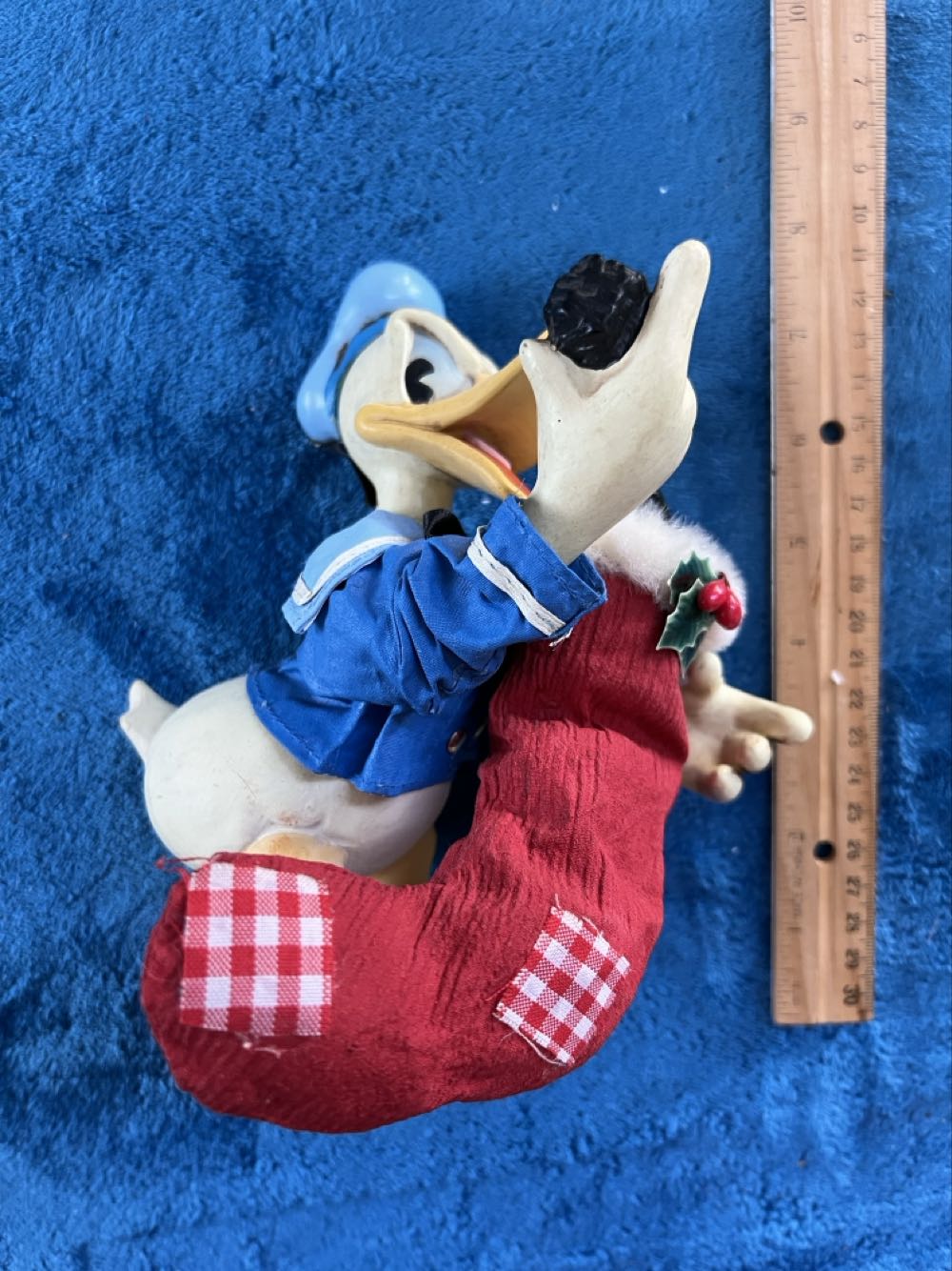 189)   Mickey & co, fabric Mache figurine. Donald Duck holding a stocking full of coal. Measures 7” and comes in its original box.   plush collectible - Main Image 2