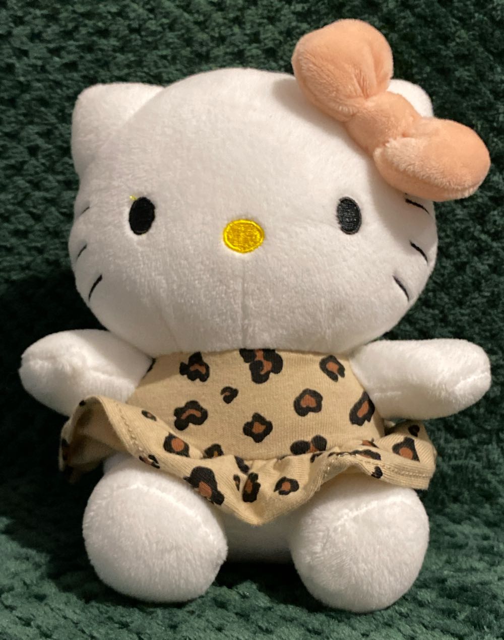 Animated Grinch in naughty sweater, holding stocking with candy, cane side stepper