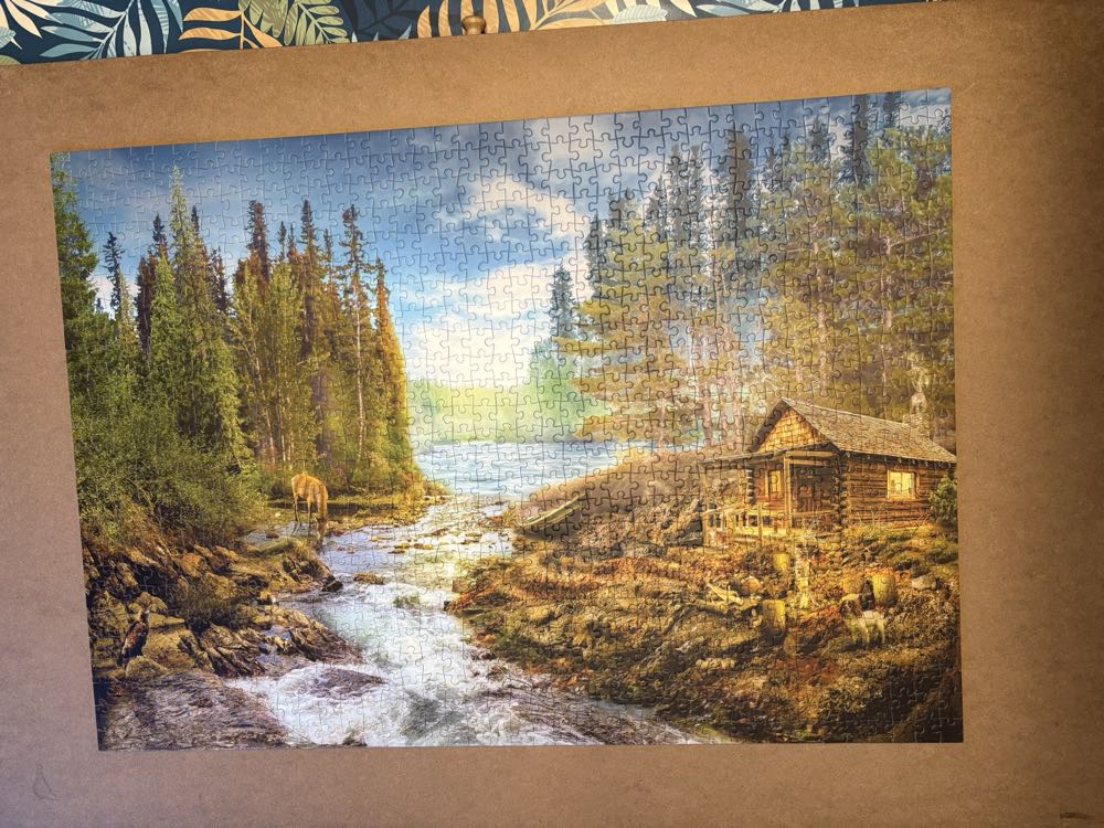 A Log Cabin By The Rapids - Enjoy Puzzle puzzle collectible [Barcode 5949194016051] - Main Image 2