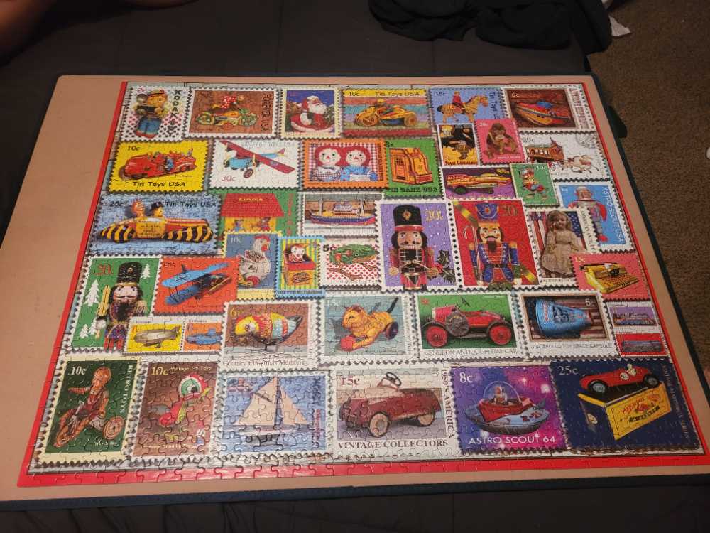 White Mountain Puzzles Christmas Toy Stamps Piece Jigsaw Puzzle - White Mountain puzzle collectible [Barcode 724819261369] - Main Image 3