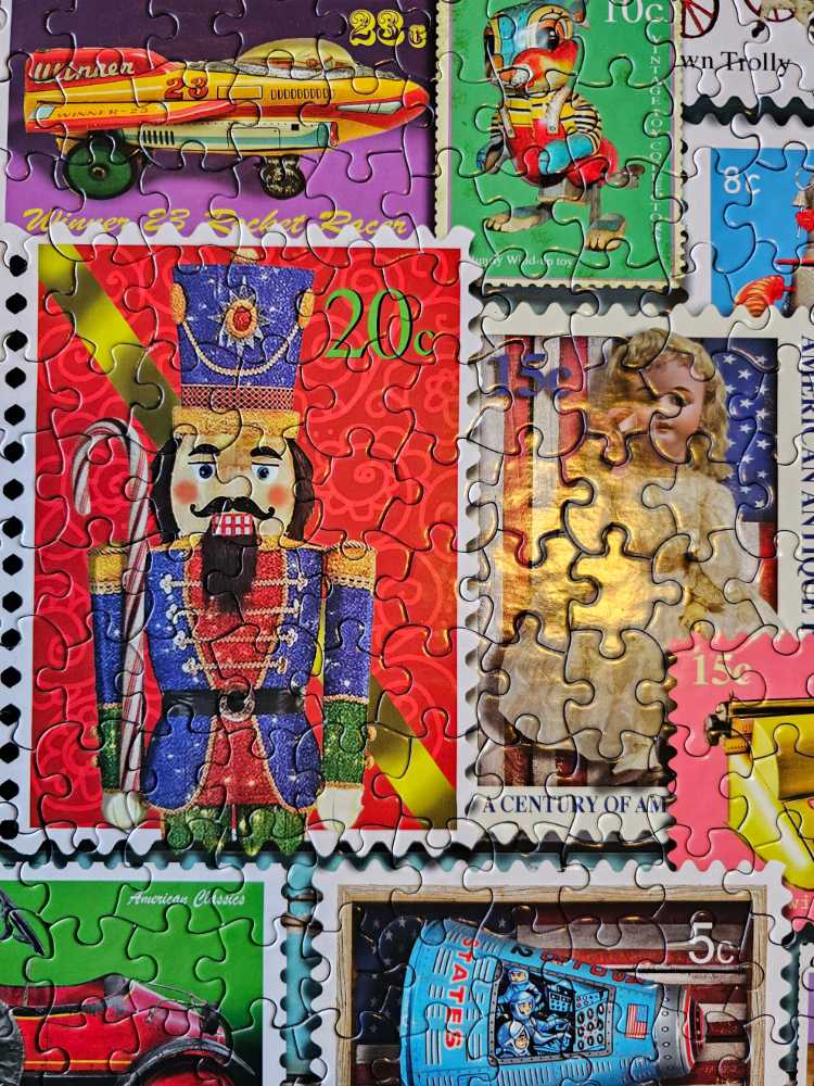 White Mountain Puzzles Christmas Toy Stamps Piece Jigsaw Puzzle - White Mountain puzzle collectible [Barcode 724819261369] - Main Image 4