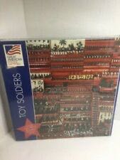 Tabby Kitten Sleeping In Bowl And Pile Of Fabric Hearts