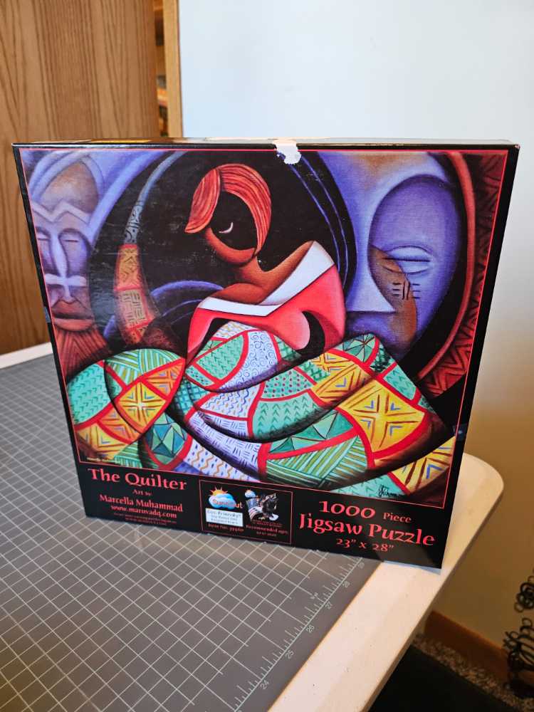 The Quilter - SunsOut puzzle collectible [Barcode 796780394605] - Main Image 2