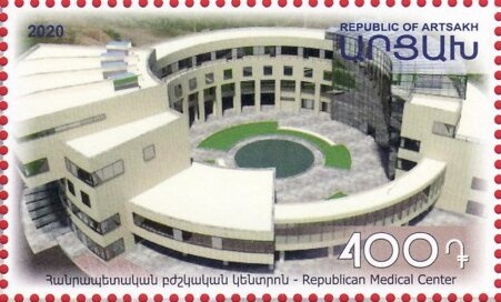 Hand holding cancer fund emblem