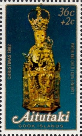 Olympic torch and Cook Island canoes