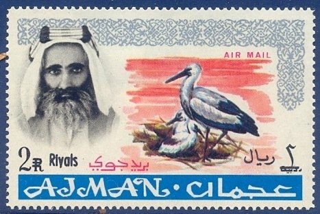 ‭Hands holding Communist manifest, hammer and sickle