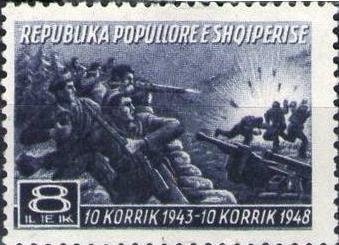 Miner with Jackhammer in Front of an Industrial Plant