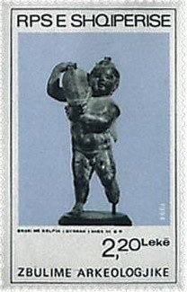 ‭Athletes with shot and Indian club