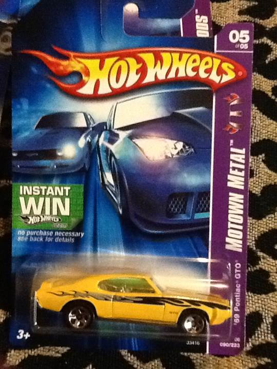 Hotwheels ’69 Pontiac GTO Yellow - Motown Metal toy car collectible - Main Image 1