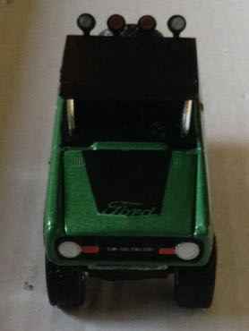 Ford Bronco 1976 Verde Con 4 Faros Y Llanta Trasera - Greenlight toy car collectible - Main Image 1