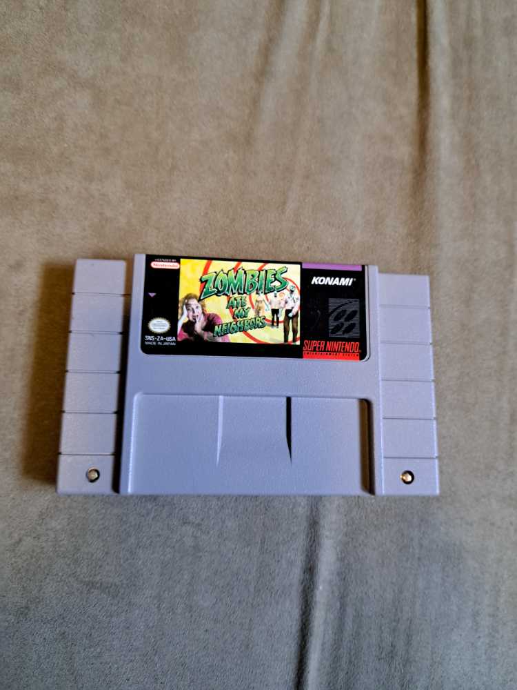 SNES: Zombies Ate My Neighbors - Nintendo Super Nintendo Entertainment System (SNES) video game collectible - Main Image 1